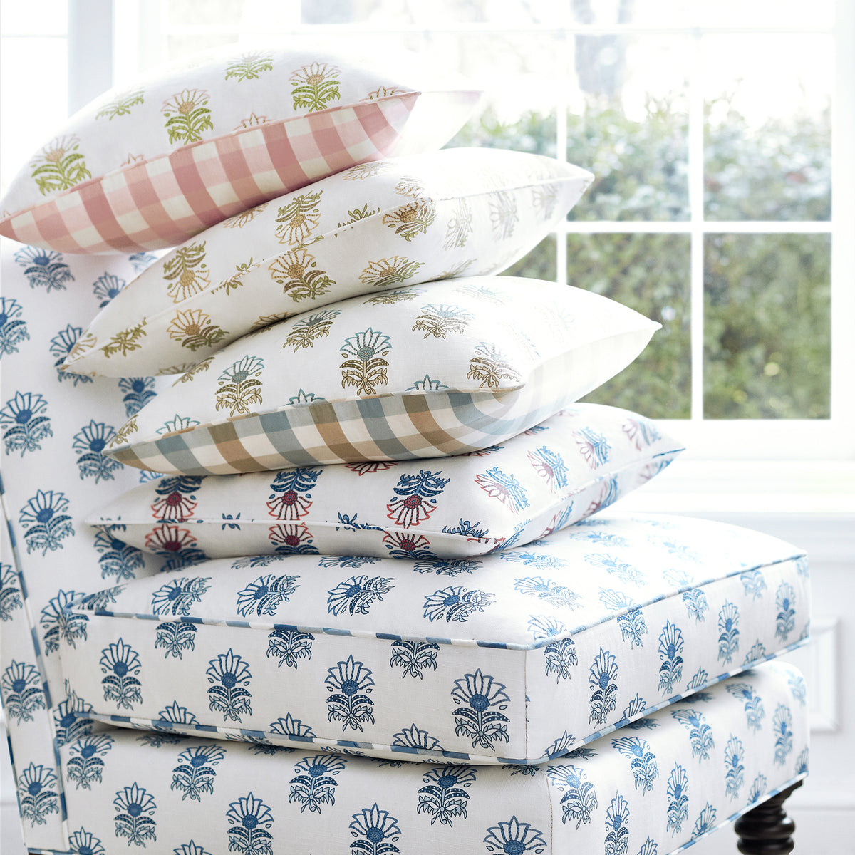 Anna French Milford pattern in a chair with pillows - Antilles collection